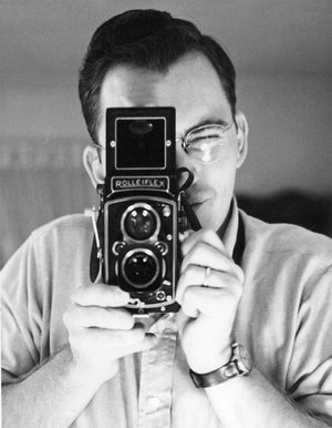 portrait of Wallace Abbey with camera