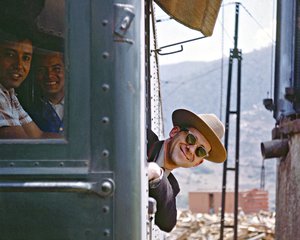 portrait of Fred Springer leaning out of a train